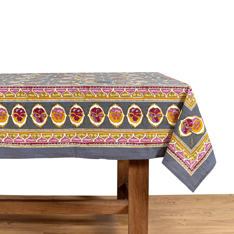 Caravan Home 71 x 106 Pansy Red & Grey Tablecloth showcasing intricate floral and abstract designs, handprinted on French linen, perfect for elegant table settings.