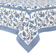 Granada Cornflower Blue Tablecloth by Caravan Home, featuring a detailed floral pattern with blue pomegranates, hand-printed for elegant dining settings.