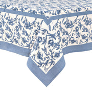 Caravan Home 71 x 71 Granada Cornflower Blue Tablecloth, featuring a hand-printed floral design with cornflower blue pomegranates on a white background.
