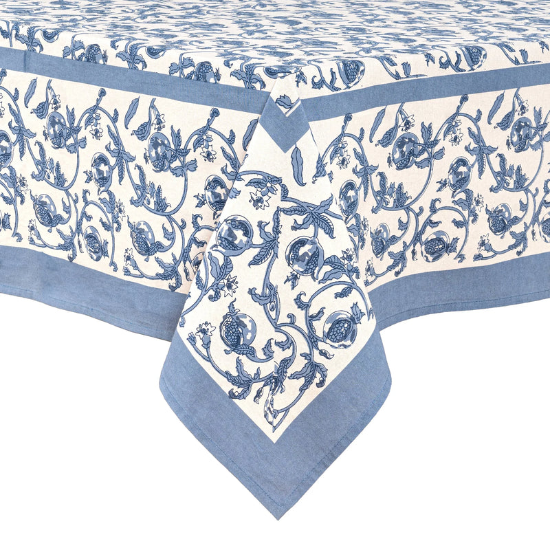Caravan Home 71 x 71 Granada Cornflower Blue Tablecloth, featuring a hand-printed floral design with cornflower blue pomegranates on a white background.