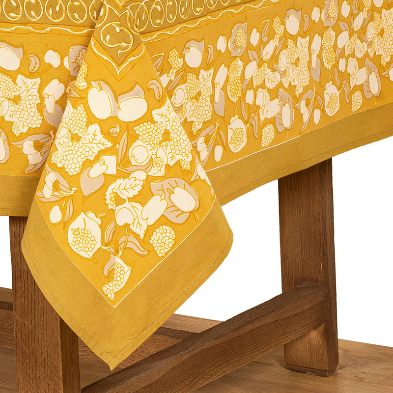 Caravan Home 59 x 86 Forest Harvest tablecloth, featuring hand-printed fruit and vine motifs, ideal for enhancing dining experiences with artisanal craftsmanship.