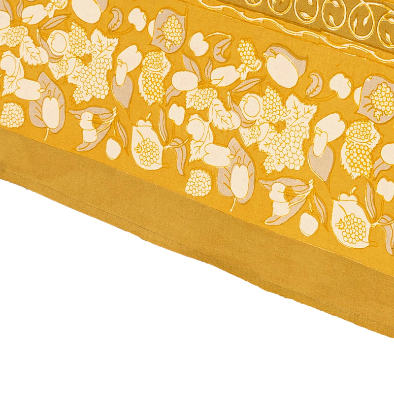 Forest Harvest Grey & Mustard Tablecloth by Caravan Home featuring a hand-printed fruit and foliage design, perfect for elevating your dining experience.