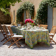Caravan Home | 71 x 71 Jardin Blue & Vert Tablecloth elegantly set on an outdoor dining table, exemplifying artisanal craftsmanship and French garden-inspired design.