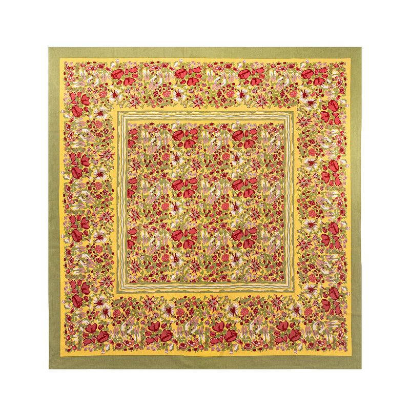 Caravan Home's 59 x 86 Red & Green Tablecloth features a vibrant floral pattern, handprinted on French linen, perfect for adding elegance to any dining setting.