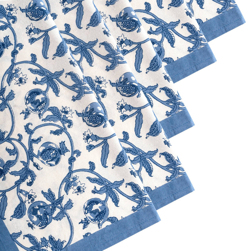 Set of six 19 x 19 Granada Cornflower Blue Napkins with floral pattern, hand-printed in blue pomegranates on white, perfect for enhancing any table setting.