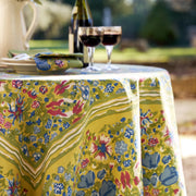 Caravan Home | 59 x 86 Jardin Blue & Vert Tablecloth on table with wine glasses, showcasing floral pattern, crafted for elegance and style.