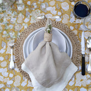 Caravan Home | 21 x 21 Stone Everyday Napkins Set of 4, elegantly folded on a table setting with glassware, enhancing dining sophistication.