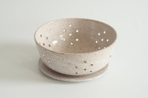RachaelPots Large Berry Bowl With Dish - White, a hand-thrown ceramic set ideal for draining berries, featuring a floral hole design, crafted in Brooklyn.