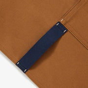 Hedley & Bennett | Essential Aprons - Tahoe Pine features durable cotton canvas with adjustable straps and multiple pockets, blending rugged practicality with stylish flair.