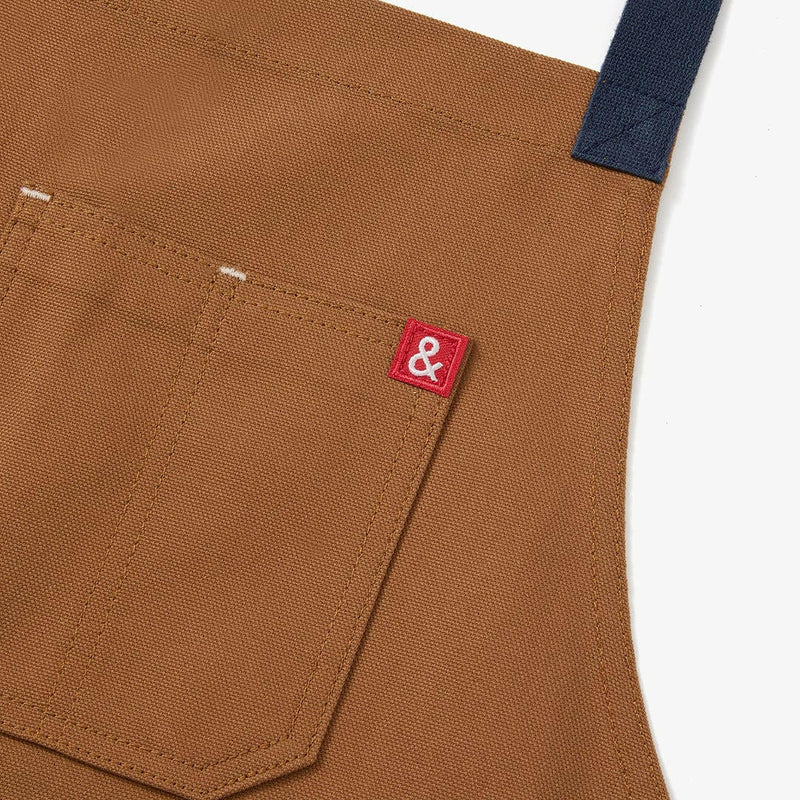 Hedley & Bennett | All Day Crossback Aprons - House Red, featuring crossback straps, ample pockets, and a utility loop, ideal for kitchen enthusiasts.