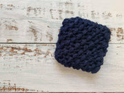 Handmade navy dish scrubbies by Dot and Army, showcasing durable, high-quality nylon knit for effective cleaning. Eco-friendly and odor-resistant, perfect for any kitchen.