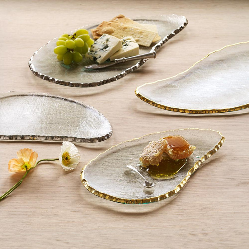 Annie Glass | Edgey Cheese Board with grapes, blue cheese, crackers, and honeycomb, showcasing its elegant metallic-trimmed design on a light wood tabletop.