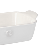 Emile Henry | Modern Classics Loaf Pan in white ceramic with integrated handles, ideal for baking bread and cakes, showcased at a slight angle.