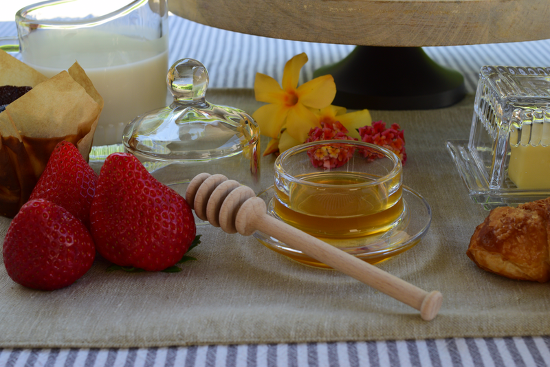 Earth & Nest | Round Cloche Condiment Dish on a table with strawberries and honey, showcasing its versatility in serving condiments or garnishes.