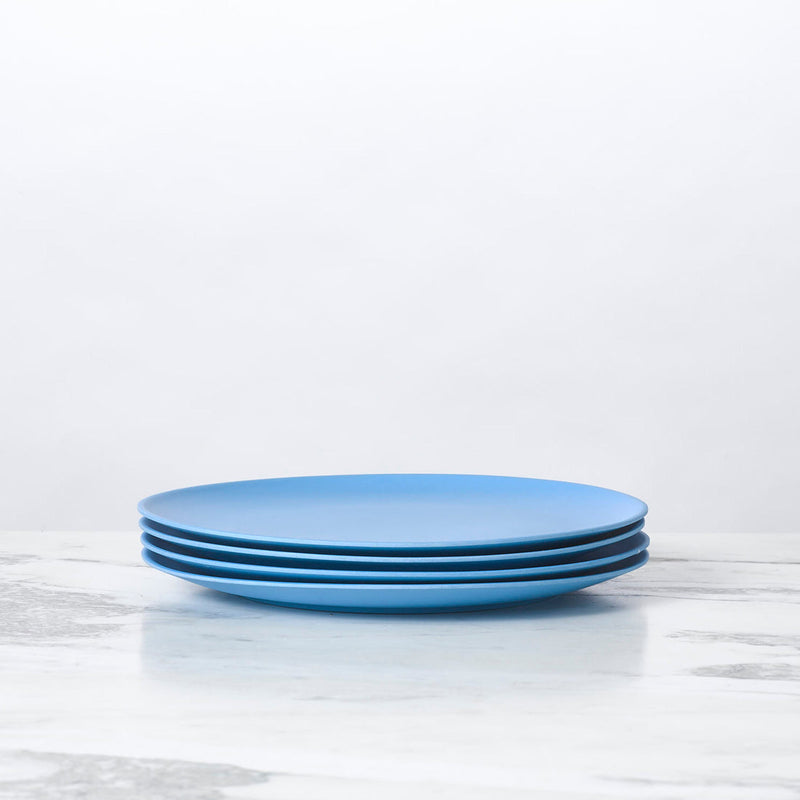 Stack of Fable New York's eco-friendly, 5.5-inch bamboo cereal bowls, part of the illustrated collection, perfect for serving meals sustainably.
