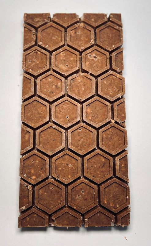 Natural Wood and Beeswax Fire Starters, close-up showing hexagonal shapes, ideal for grills or fireplaces. Made from 100% natural materials, sustainably sourced in the USA.