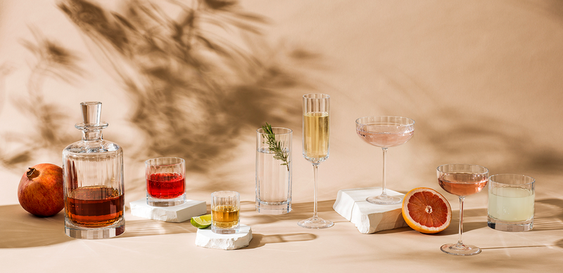 Richard Brendon | Double Old Fashioned Tumbler - Fluted, elegantly displayed with other glassware and fruits, reflecting Art Deco cocktail culture. Ideal for Whisky on the Rocks.