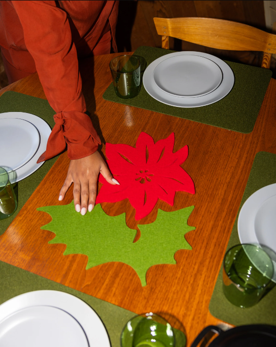 Graf Lantz Merino Wool 15 Holly Leaf Trivet in Loden Green displayed on a table, highlighting its elegant design and functionality for kitchen use.