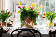 French Bee Mason Jar Small on a table with flowers and candles, showcasing its elegant, organic shape and vintage-inspired French bee seal.
