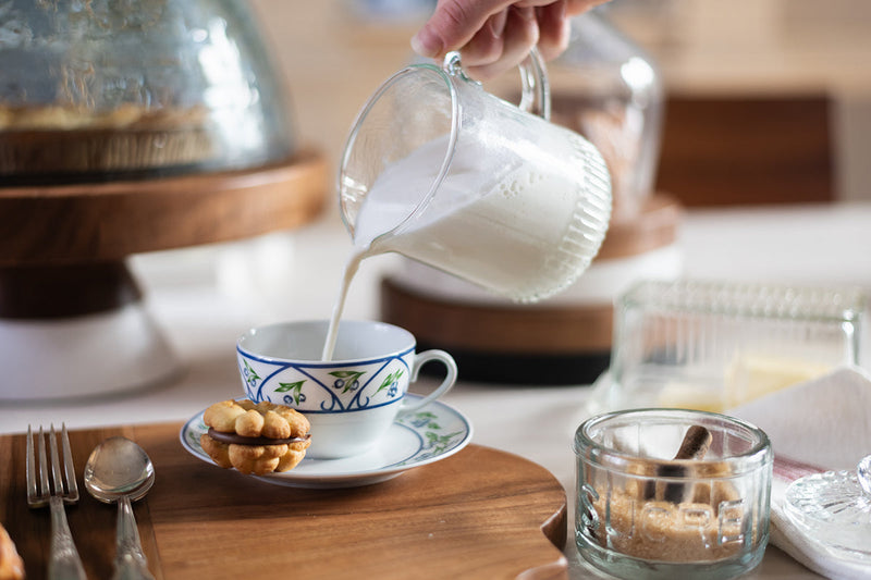 Etú Home | Bistro Mini Jug with milk being poured, showcasing its vintage-inspired design and functionality, perfect for enhancing any table setting.