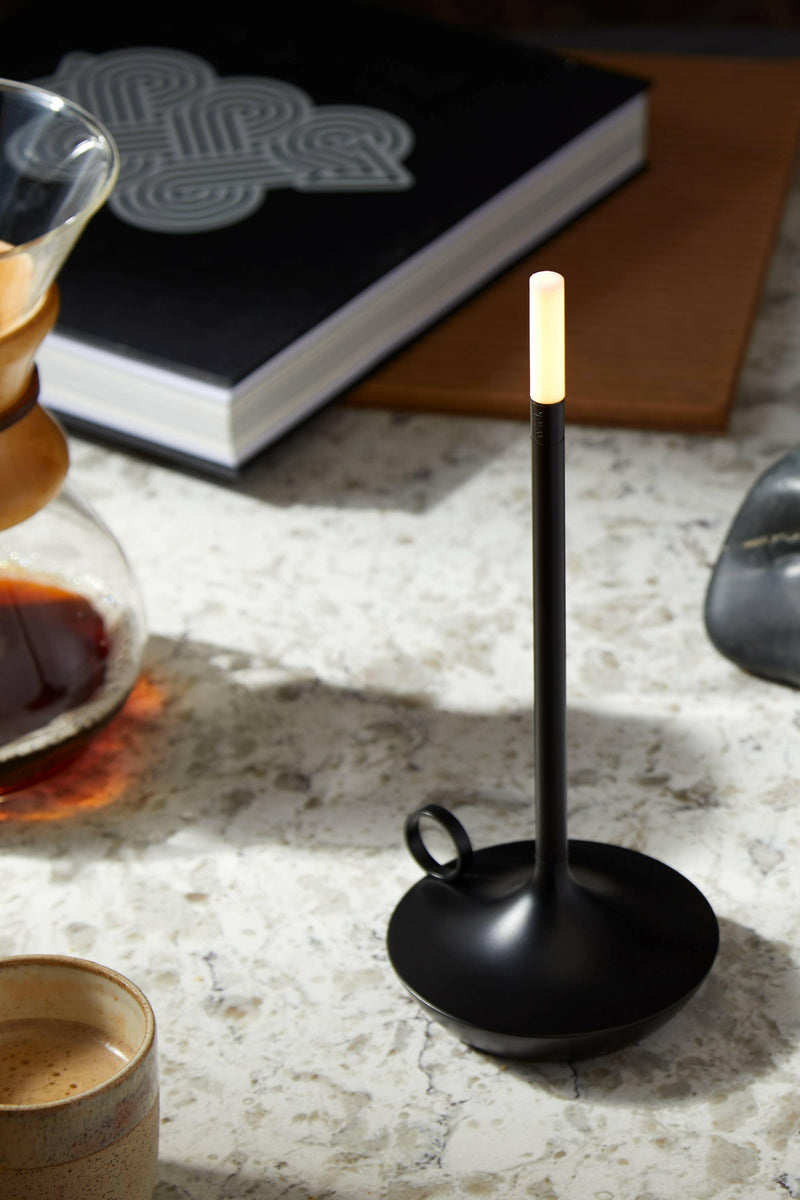 VANMOKUM | GRAYPANTS Wick Portable Rechargeable Lamp - Black, elegantly blending candle romance and flashlight utility, ideal for creating ambient gathering spaces indoors.
