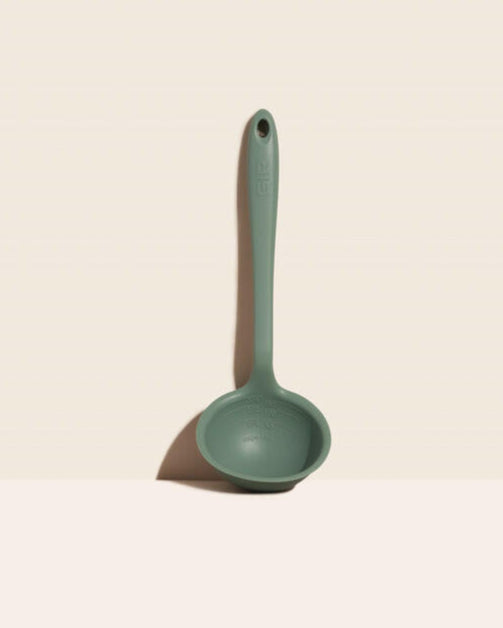 GIR | Ultimate Ladle - Navy, featuring a precision pouring edge and deep scoop, shown on a white surface for precise and versatile kitchen tasks.