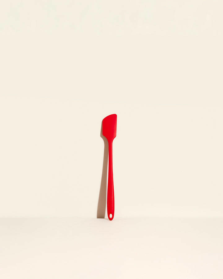 GIR | Skinny Spatula - Navy, showcasing its sleek, hygienic unibody design on a white surface, ideal for versatile kitchen use.