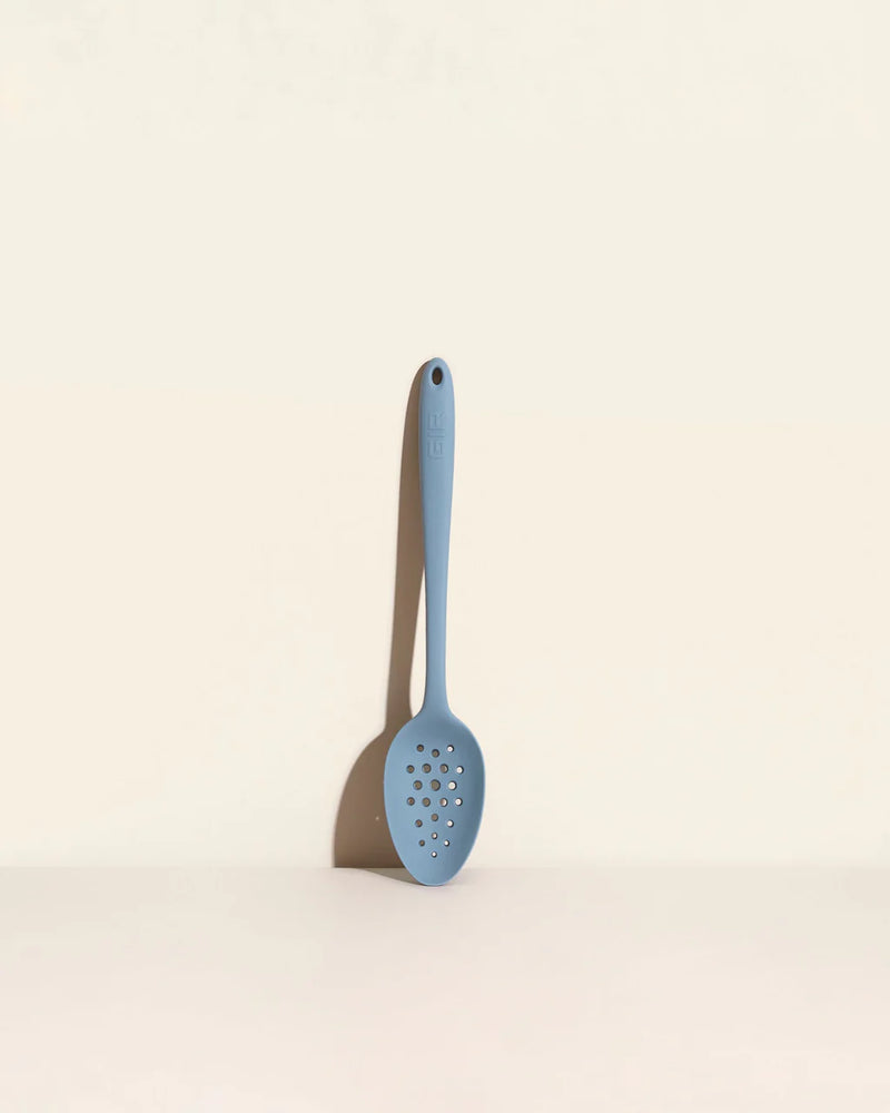 GIR | Ultimate Perforated Spoon - Slate, a versatile kitchen utensil with branching holes, ideal for straining and skimming in culinary tasks.