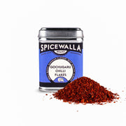 Spicewalla | Gochugaru Chilli Flakes tin beside vibrant chili flakes, ideal for adding fruity, smoky spice to dishes, from Athens Cooks' specialty food collection.