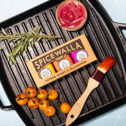 Spicewalla | Ultimate Backyard BBQ Collection - 3 Pack with grill pan, basting brush, pickled onions, rosemary, and cherry tomatoes, showcasing BBQ rubs for elevated culinary grilling.