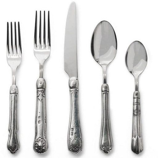 Arte Italica & Crown Linen Designs | Hotel 5-Piece Placesetting showcasing intricately detailed Italian pewter and stainless steel silverware, featuring two forks, a knife, and two spoons.