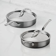 Hestan | Cookware, 3.5qt Sauté Pan + Lid on white surface, showcasing ergonomic handles and durable titanium-enhanced construction, ideal for versatile cooking in Athens Cooks' curated collection.