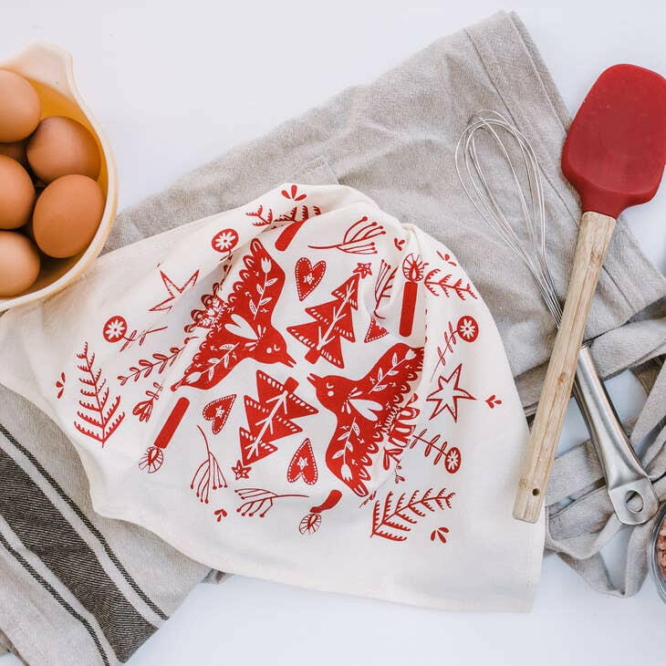 Your Green Kitchen | Holiday Tea Towels - Holiday Houses displayed with kitchen utensils and eggs, showcasing their practicality and style in a culinary setting.