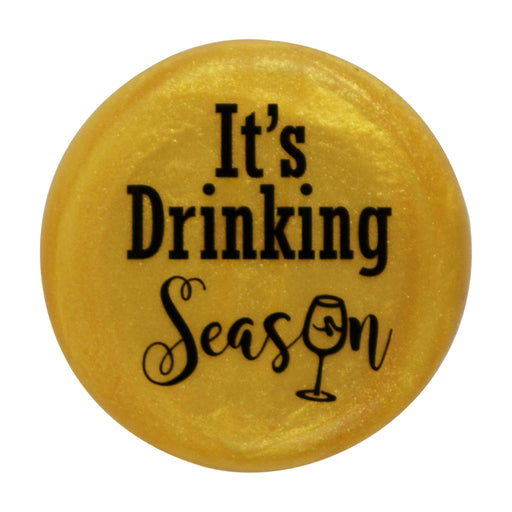 CapaBunga | Holiday Wine Caps - Santa Paws, featuring a yellow circular design with black text, ideal for festive wine bottle sealing.