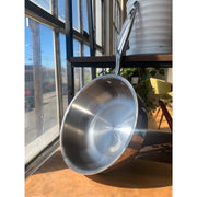 Heritage Steel | Titanium Series Sauciers with Lids - 3 Quart displayed on a shelf, showcasing sleek metal design ideal for whisking sauces and cooking risotto.