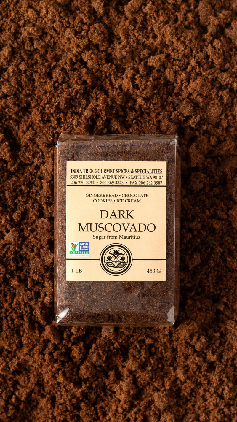 India Tree | Sugars - Dark Muscovado, showcasing premium quality and rich, molasses flavor, perfect for baking and cooking, highlighted in a close-up of its elegant packaging.