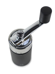 Peugeot Isen Nutmeg Mill, Matte Black, featuring a hand-crank mechanism for safely grinding nutmeg with precision, ideal for enhancing culinary creations.
