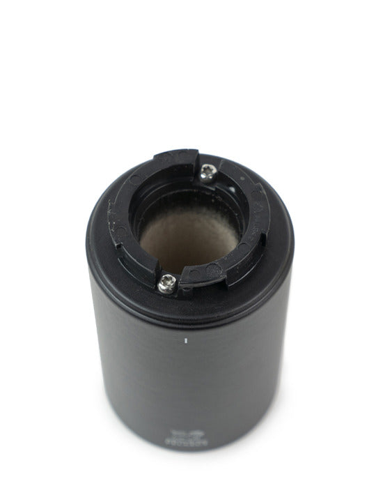 Peugeot Isen Nutmeg Mill, Matte Black: A compact mill with a secure mechanism for finely grinding nutmeg, featuring a sparkling metal and elegant matte black finish.