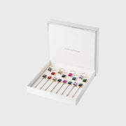 Joanna Buchanan Party Set of Cocktail Picks and Wine Charms displayed in a jewelry box, ideal for entertaining, reflecting Athens Cooks' curated barware selection.