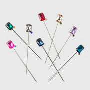 Joanna Buchanan Party Set includes cocktail picks and wine charms adorned with various gemstones, perfect for elegant entertaining from Athens Cooks.