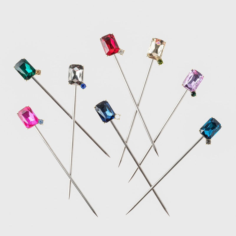 Joanna Buchanan Party Set includes cocktail picks and wine charms adorned with various gemstones, perfect for elegant entertaining from Athens Cooks.
