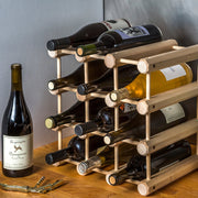 J.K. Adams | Wine Racks, 12 Bottle: A modular wooden rack holding wine, with a bottle of La Garagista and corkscrew on a wooden counter.