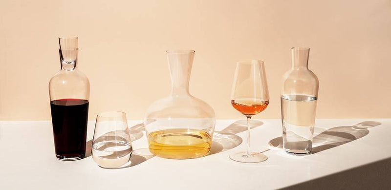 Richard Brendon | Jancis Robinson Original Wine Glass Set of 2, featuring tulip-shaped bowls designed for maximizing wine aromas and flavors, displayed with a bottle.