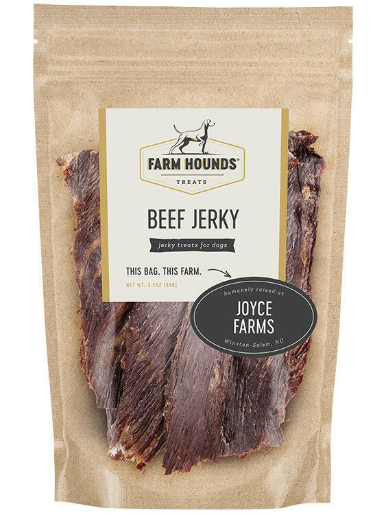 Farm Hounds | Jerky Treats - Turkey Jerky package beside a black and white dog, showcasing the natural, protein-rich, USA-sourced pet snack.