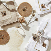 Joanna Buchanan | Bee Cocktail Picks, a set of six whimsical bee-themed picks on a towel, ideal for garnishing drinks, enhancing cocktail presentation.