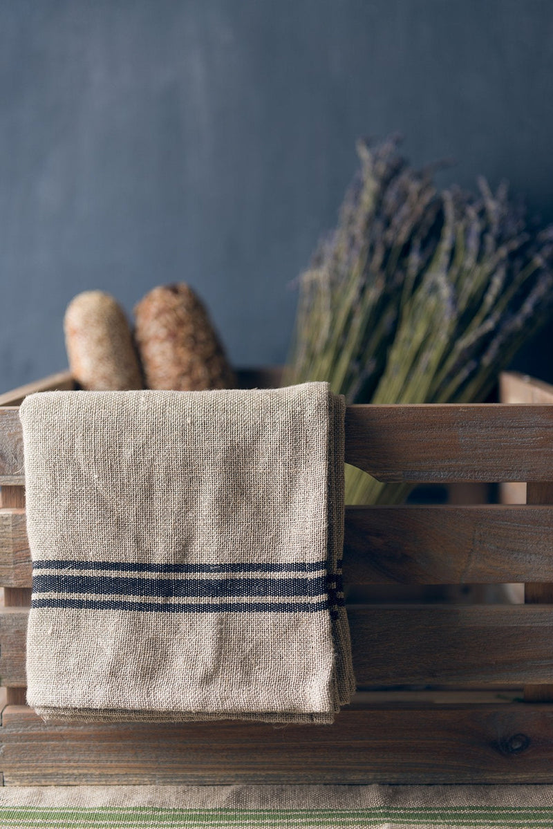 Thieffry | Monogramme Napkin Set of 4 displayed in a wicker basket with lavender, highlighting their elegant linen texture and timeless appeal.