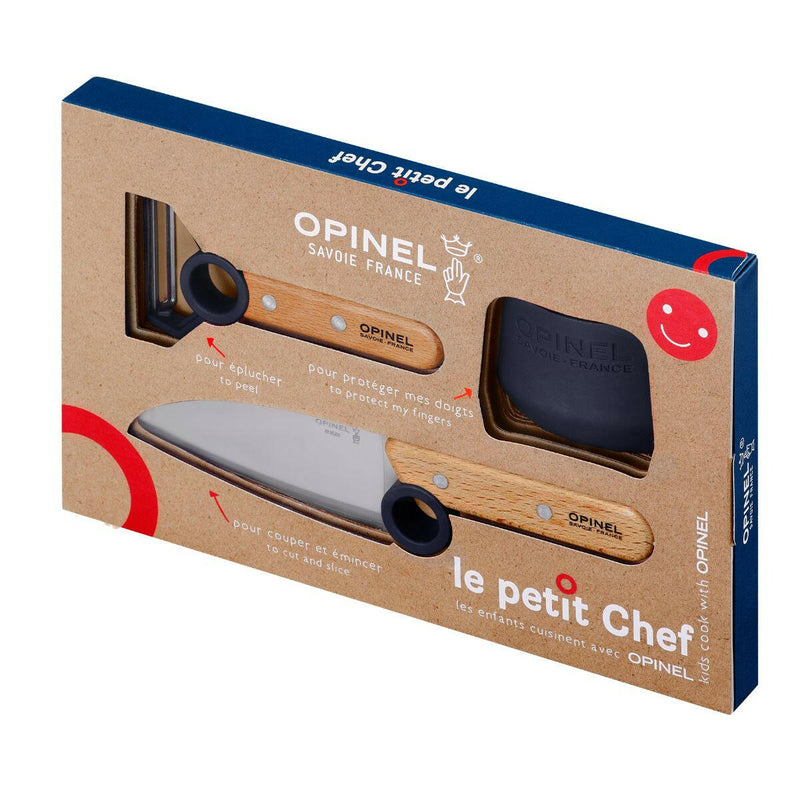 Opinel | Le Petit Chef 3pc Knife Set features a kids' chef knife, peeler, and finger guard in a cardboard box, ideal for teaching safe cooking techniques.