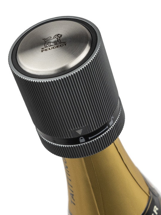 Close-up of a champagne bottle highlighting Peugeot | BULK DISPLAY Line Bottle Stoppers - Carbon, ideal for sealing and preserving wines or spirits.