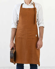 Men's Linen Bib Apron by MagicLinen, featuring adjustable straps and a twin-sectioned pocket, ideal for cooking or gardening, available at Athens Cooks.
