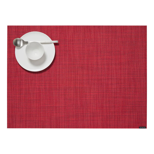 Chilewich Mini Basketweave Rectangular Placemat in Scarlet with a white plate, bowl, and spoon, showcasing its elegant texture ideal for dining settings.